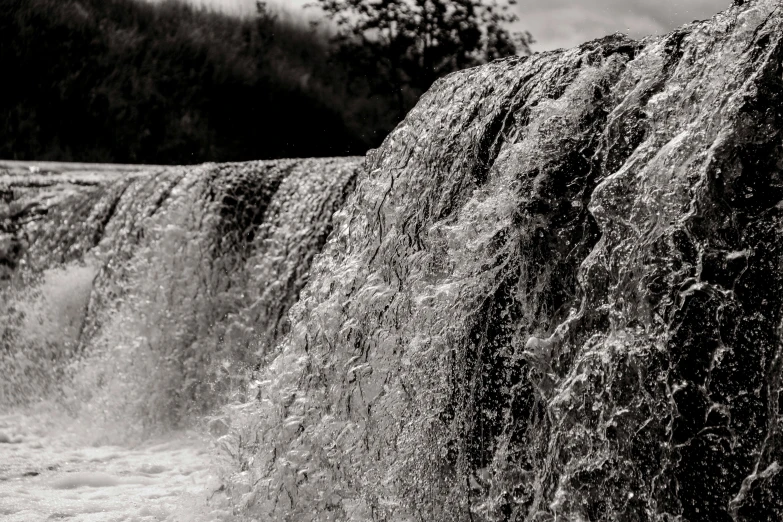 a black and white photo of a waterfall, a black and white photo, unsplash, process art, irrigation, floods, monochrome hdr, detailed water