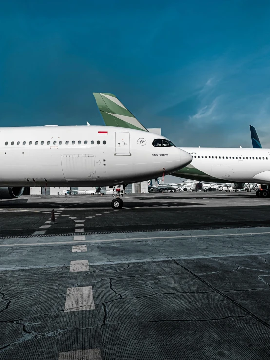 a large jetliner sitting on top of an airport tarmac, by Andries Stock, pexels contest winner, renaissance, jakarta, image split in half, profile image, thumbnail