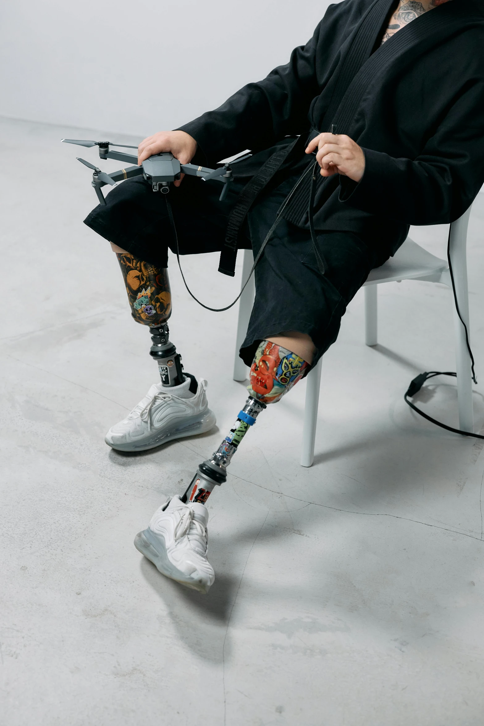 a man with a broken leg sitting on a chair, trending on pexels, hyperrealism, wearing japanese techwear, cyber augmentation implant, tattooed, a photo of a man