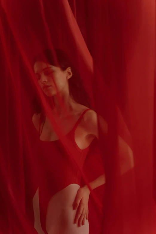 a woman standing in front of a red curtain, showstudio, wearing nothing, red flags holiday, a still of an ethereal