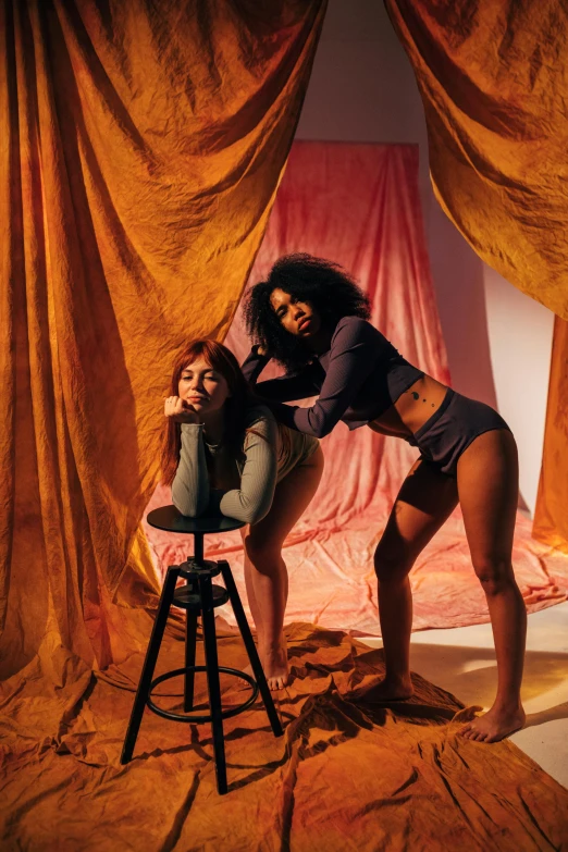 a couple of women standing next to each other, an album cover, inspired by Nan Goldin, renaissance, thick thighs, imaan hammam, sitting on a stool, wavy lingeries