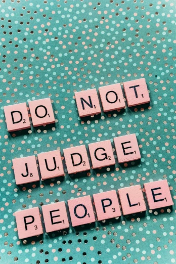 a sign that says don't judge people, by Julia Pishtar, pexels, pop art, 2 5 6 x 2 5 6 pixels, flatlay, jury, teal and pink