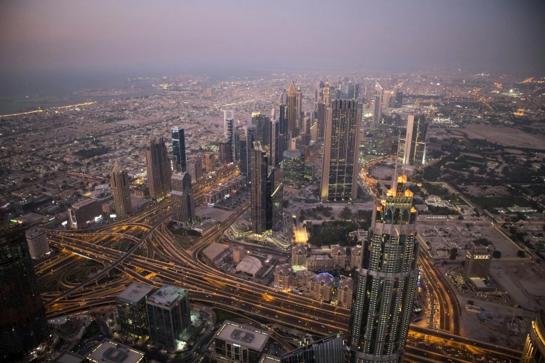 an aerial view of a city at night, pexels contest winner, hurufiyya, dubai, fan favorite, twilight skyline, fine art print