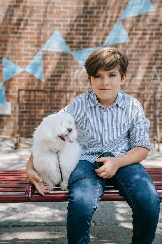 a boy sitting on a bench with a white dog, a portrait, pexels contest winner, american barbizon school, isabela moner, portrait image, portrait of small, promo image