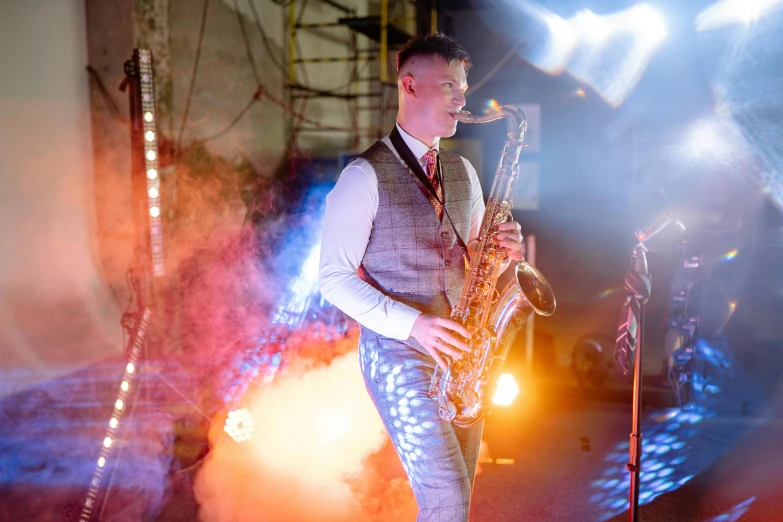 a man in a vest playing a saxophone, by Joe Bowler, happening, industrial party, lit up, band playing, thumbnail