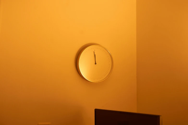 a large clock mounted to the side of a wall, by Yasushi Sugiyama, postminimalism, gradient light yellow, indoor dim light, soft light - n 9, glossy white metal