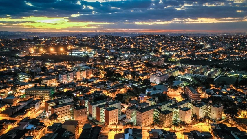an aerial view of a city at night, by Felipe Seade, golden hour photo, bispo do rosario, university, ad image