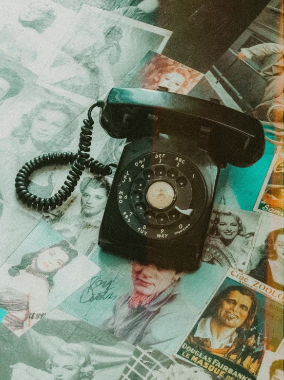 a black telephone sitting on top of a bed, an album cover, by Robbie Trevino, trending on pexels, vintage old, dial, a collage, 15081959 21121991 01012000 4k