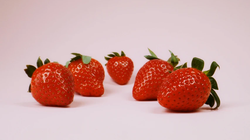 a group of strawberries sitting on top of a white surface, by Gavin Hamilton, pexels contest winner, pink, plain background, 🦩🪐🐞👩🏻🦳, profile pic