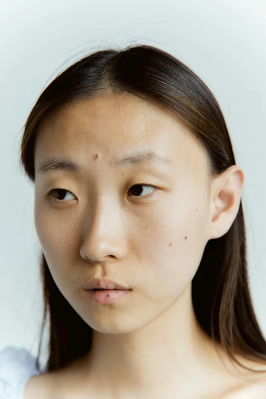 a close up of a person with a cell phone, an album cover, inspired by Fei Danxu, reddit, hyperrealism, pale pointed ears, ethnicity : japanese, headshot photograph, dezeen