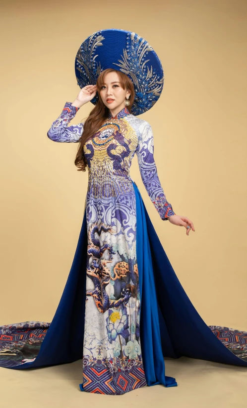 a woman in a blue hat and dress, an album cover, inspired by Jin Nong, ao dai, 15081959 21121991 01012000 4k, wearing ornate clothing, full body photograph