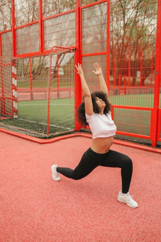 a woman standing on a tennis court holding a racquet, pexels contest winner, arabesque, doing splits and stretching, curvy crossfit build, red grid, 15081959 21121991 01012000 4k