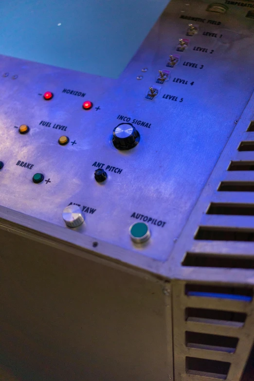 a machine that is sitting on top of a table, flickr, softly glowing control panels, high angle close up shot, 2 5 6 x 2 5 6 pixels, battered