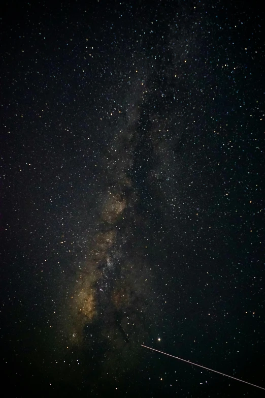 a plane flying through the night sky with the milky in the background, trending on unsplash, light and space, black sky full of stars, brown, the midjourney multiverse, medium closeup