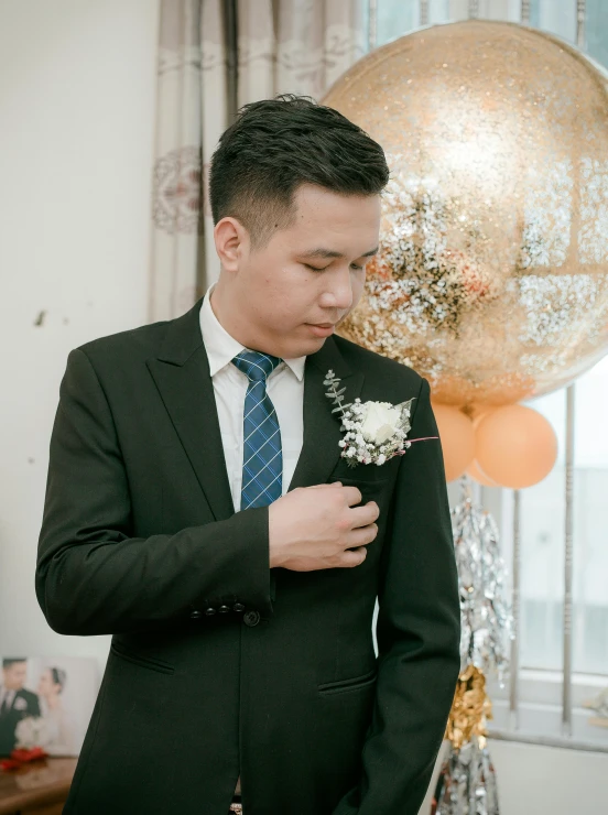 a man in a suit adjusting his tie, a colorized photo, inspired by Xie Huan, unsplash, glittery wedding, 🤬 🤮 💕 🎀, 21 years old, dang my linh