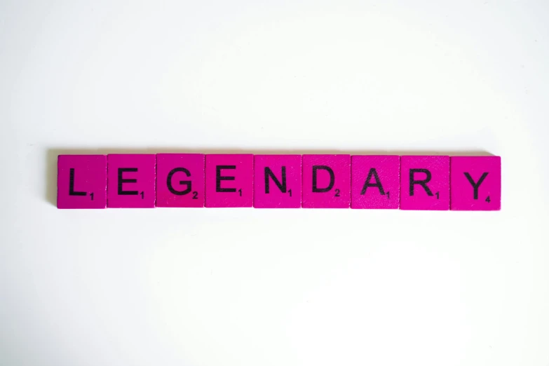 a pink wooden block with the word legendary written on it, by Jens Søndergaard, trending on pixabay, on a gray background, gengar, superhero, set against a white background