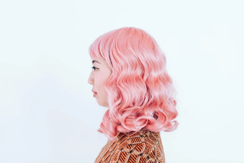 a close up of a person with pink hair, inspired by Cindy Sherman, unsplash, set against a white background, gemma chen, wavy, facing away