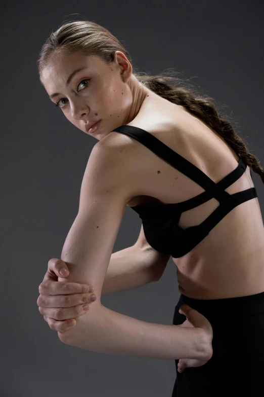 a woman in a black bra top holding a tennis racquet, inspired by Elizabeth Polunin, detailed body structure, wearing a crop top, style of maciej kuciara, promotional image