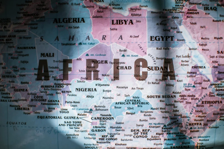 a close up of a map of africa, an album cover, pexels, hurufiyya, background image, xenophobia, middle east, thumbnail