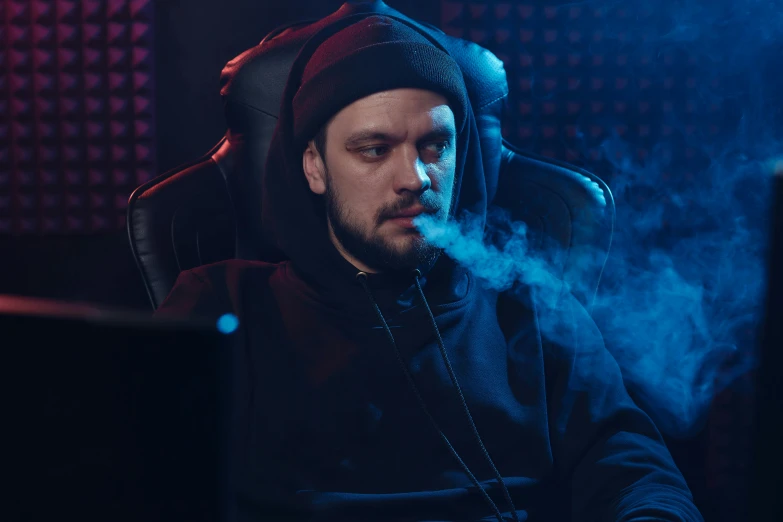 a man sitting in a chair smoking a cigarette, pexels contest winner, renaissance, wearing a gaming headset, in a black hoodie, avatar image, penguinz0