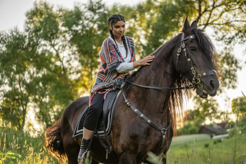 a woman riding on the back of a brown horse, a portrait, by Emma Andijewska, pexels contest winner, renaissance, wearing an elegant tribal outfit, isabela moner, promotional image, southern slav features