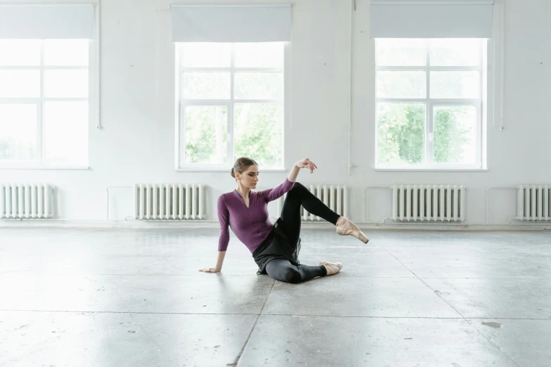 a woman sitting on the floor doing a yoga pose, by Nina Hamnett, arabesque, sitting in an empty white room, anna kovalevskaya, promo image, multiple stories