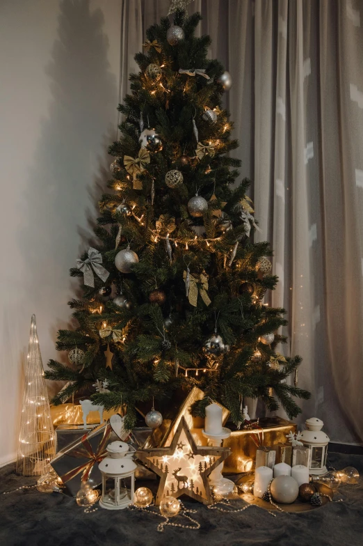 a christmas tree in the corner of a room, a portrait, pexels, grey and gold color palette, low lighting, brown, gif