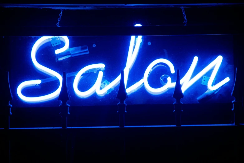 a neon sign that says salon on it, flickr, photorealism, vibrant blue, paul barson, signed, salad