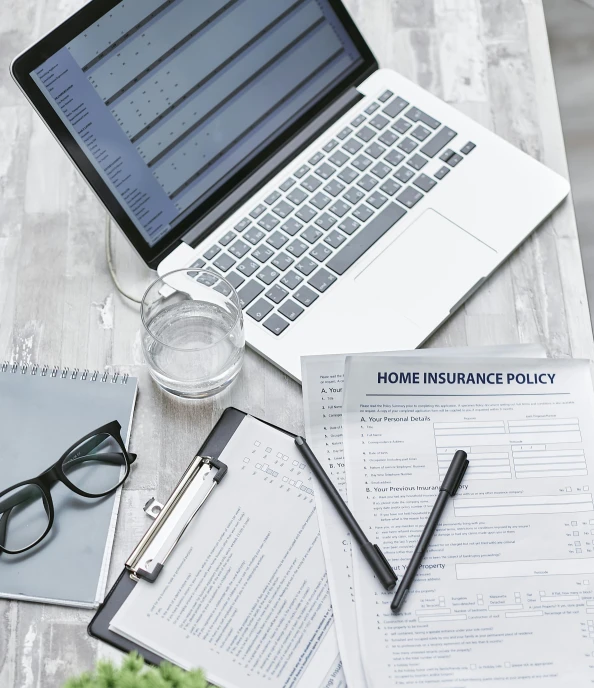 a laptop computer sitting on top of a wooden table, selling insurance, simplified forms, high quality photo, grey