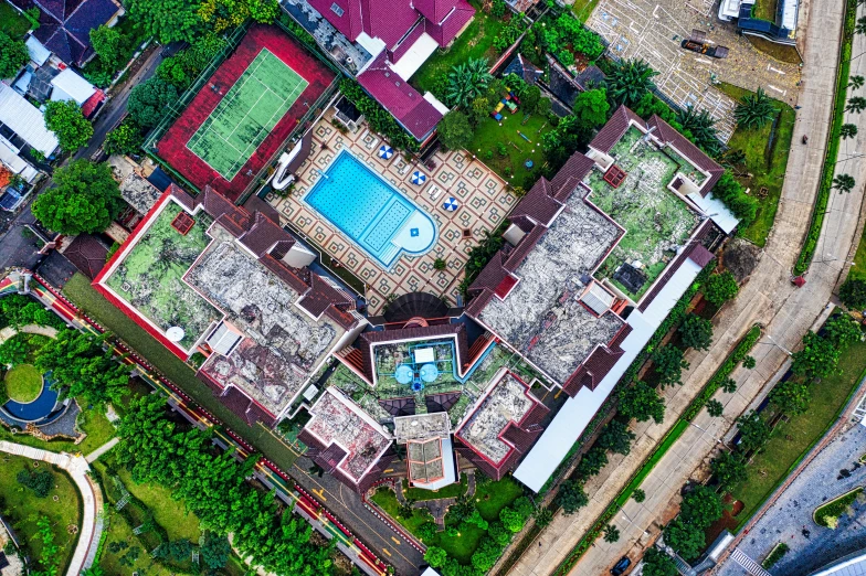 an aerial view of a house with a swimming pool, by Bernardino Mei, south jakarta, thumbnail, background, sport