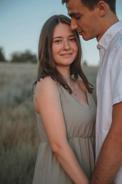 a man and woman standing next to each other in a field, a picture, pexels contest winner, a cute young woman, body and headshot, dylan kowalsk, plain background