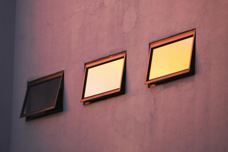 three windows on the side of a building, a minimalist painting, inspired by Elsa Bleda, unsplash, gold and purple, dimmed pastel colours, picture frames, mirror shades