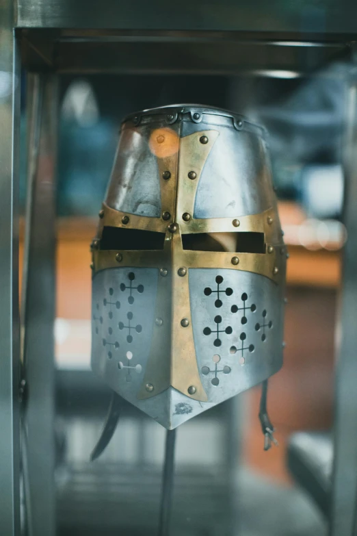 a close up of a helmet in a glass case, pexels contest winner, renaissance, shining armour made of steel, holy crusader, slightly pixelated, instagram post