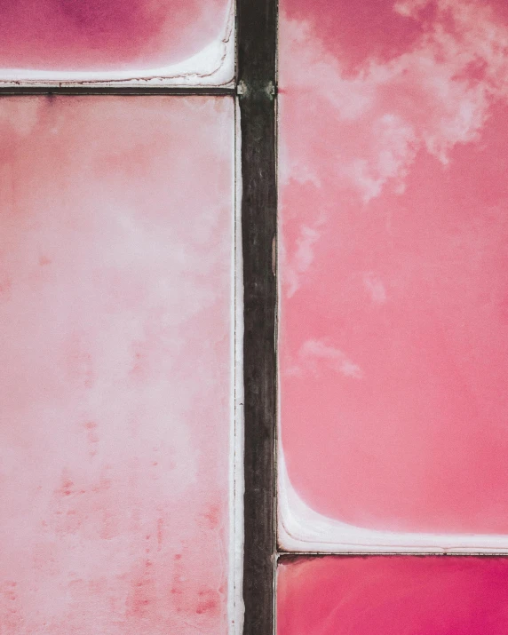 a close up of a window with a sky in the background, inspired by Julian Schnabel, trending on unsplash, color field, pink and black, pale red, frank moth, large stained glass windows