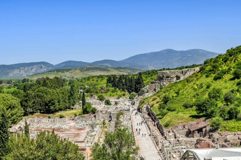 the ruins of the ancient city of volteria, italy, by Julia Pishtar, pexels contest winner, avatar image, with mountains in background, dionysus, bright summer day