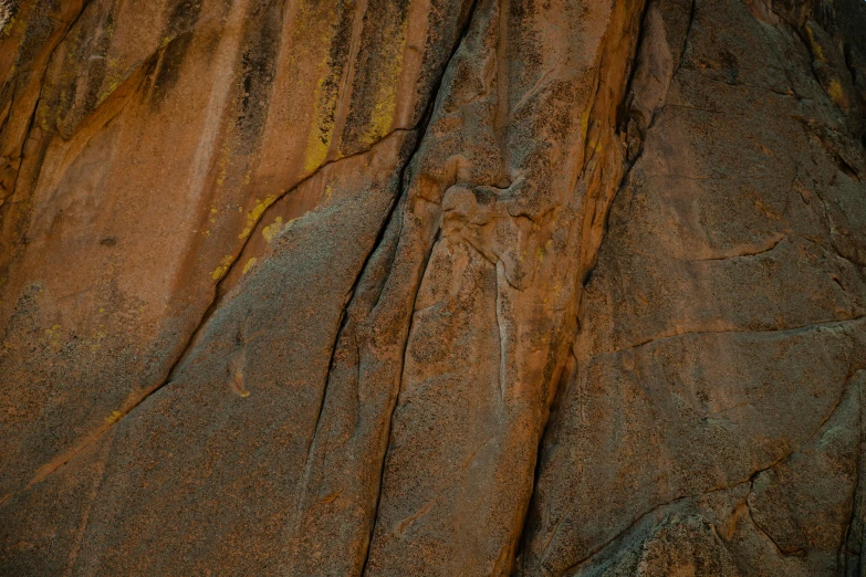 a man that is standing on a rock, a cave painting, by Lee Loughridge, pexels contest winner, australian tonalism, golden cracks, closeup 4k, panels, brown