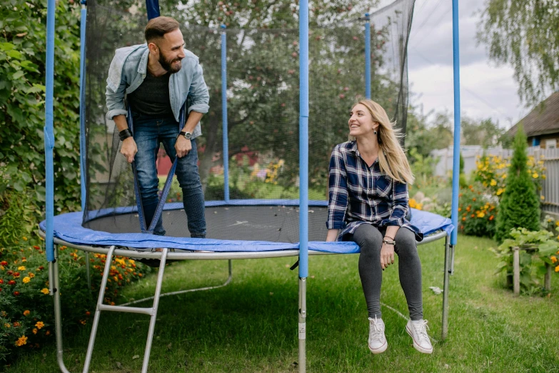 a man and a woman playing on a trampol, pexels contest winner, in the garden, avatar image, leisure activities, bouncing