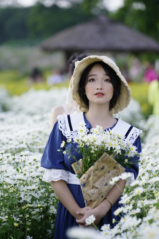 a woman standing in a field of white flowers, a picture, inspired by Yun Du-seo, wearing 1850s era clothes, wearing a navy blue utility cap, ulzzang, 2019 trending photo