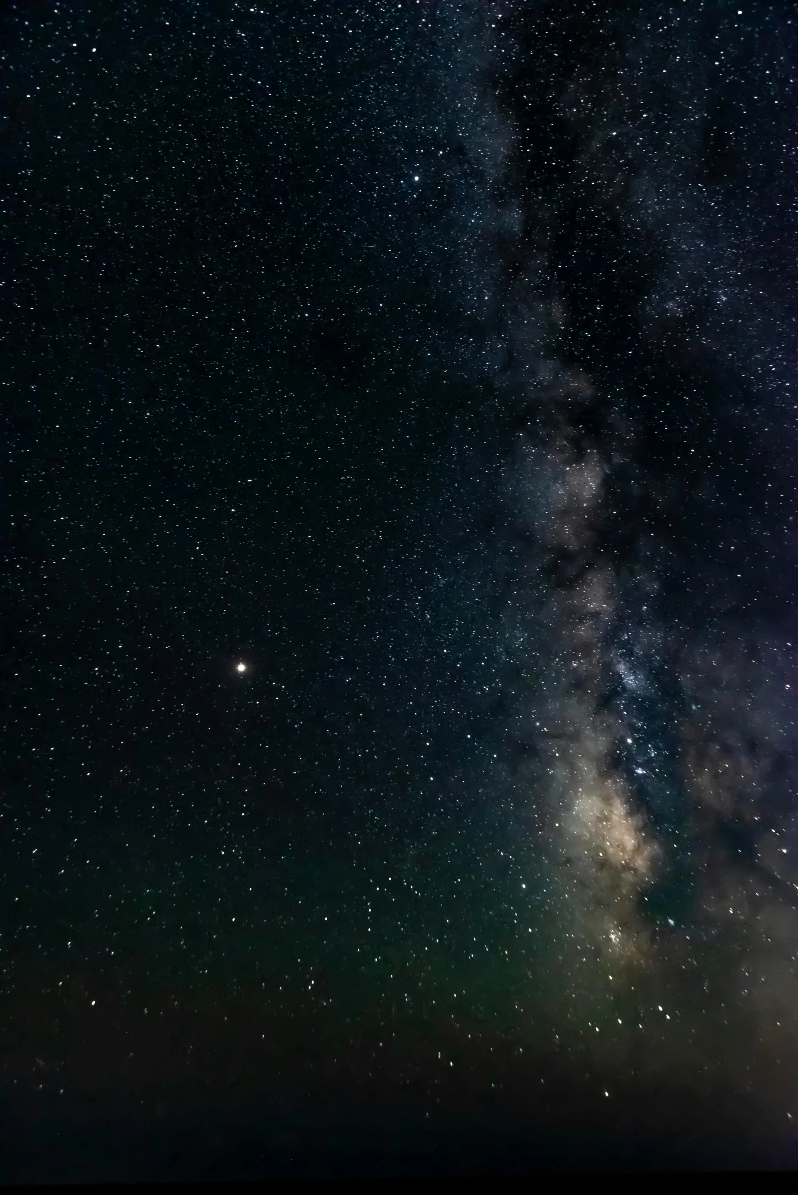 the milky shines brightly in the night sky, by Greg Rutkowski, trending on unsplash, atmospheric 8k, cinematic footage, wide long view, extremely grainy