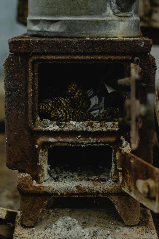 an old stove with a pot on top of it, inspired by Elsa Bleda, unsplash contest winner, assemblage, smokey burnt envelopes, texture of old rust and trash, close up camera on bonfire level, micro detailed