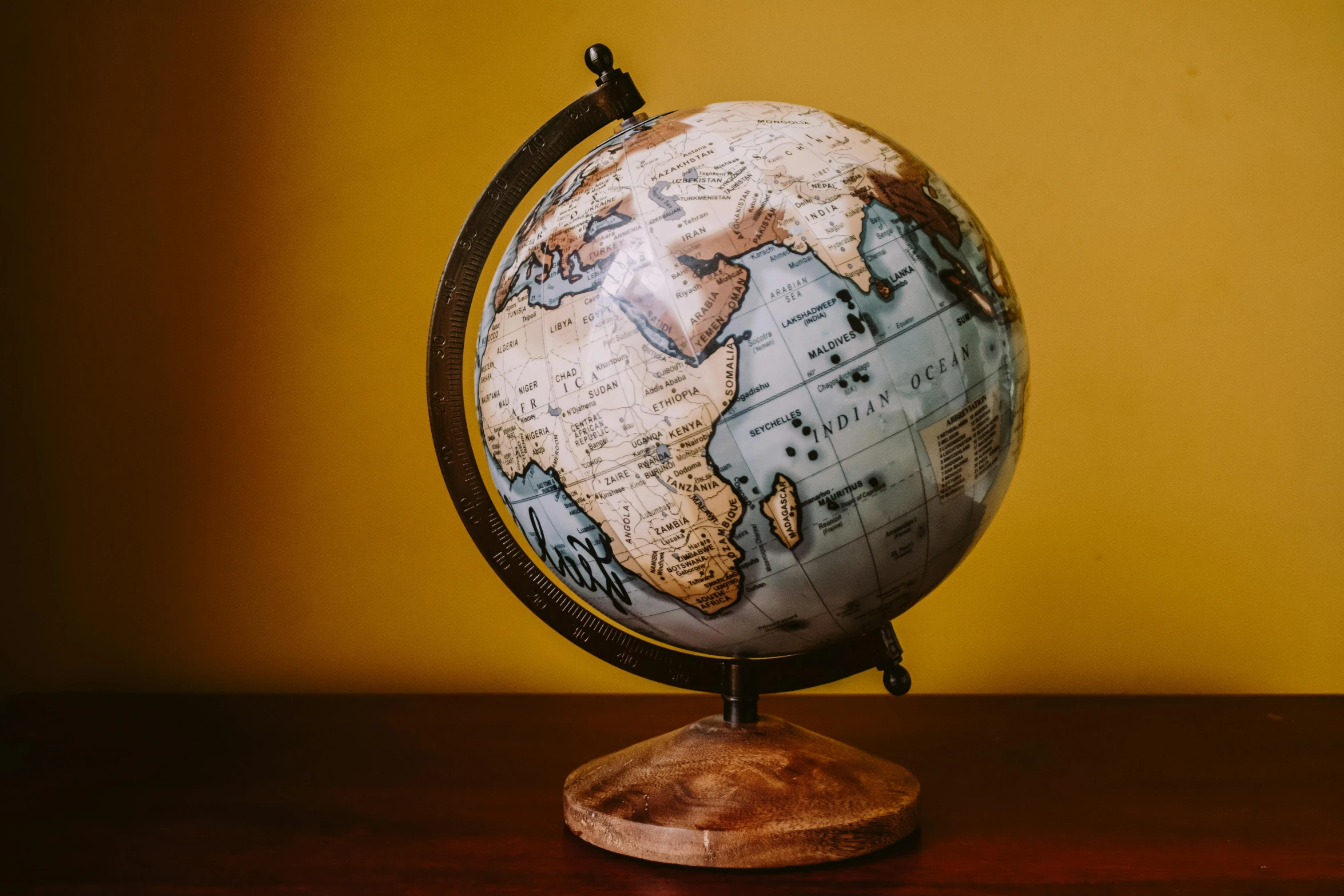 a globe sitting on top of a wooden table