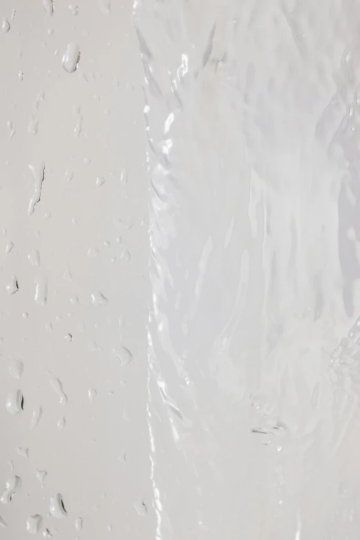 a close up of a toothbrush in a plastic bag, an album cover, inspired by Lucio Fontana, unsplash, plasticien, detailed white liquid, raindrop, skin textures, hegre