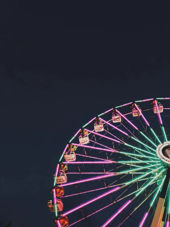 a ferris wheel is lit up at night, pexels contest winner, pink and triadic color scheme, profile image, a green, night time footage