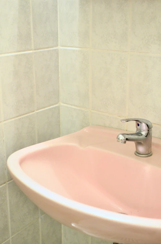 a pink sink in a white tiled bathroom, an album cover, inspired by Elsa Bleda, detail shot, 2 5 6 x 2 5 6 pixels, pareidolia, healthcare