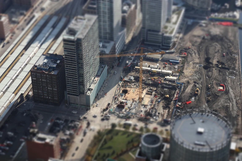 an aerial view of a construction site in a city, a tilt shift photo, pexels contest winner, photorealism, chicago, thumbnail, gigapixel photo, blurred