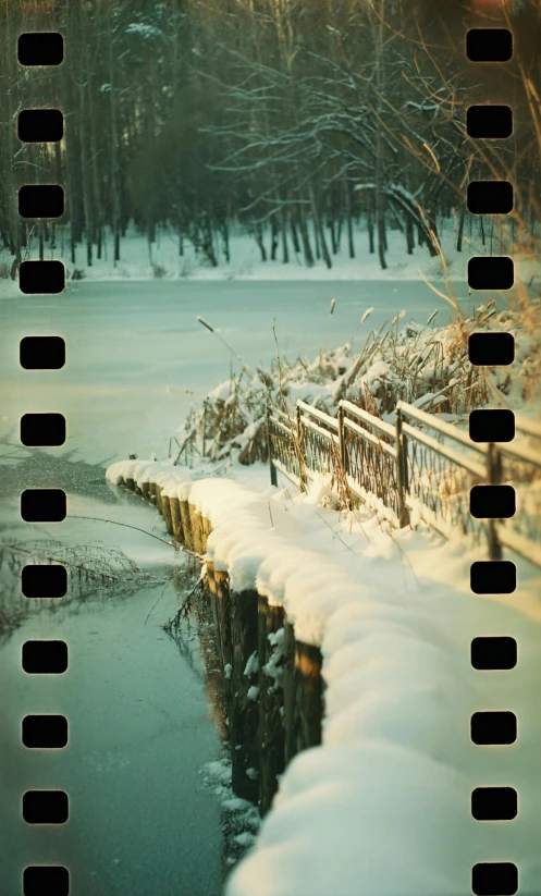 a bridge over a body of water covered in snow, a polaroid photo, inspired by Vasily Polenov, unsplash, super 8mm, panoramic anamorphic, \!cinestill 50d! film photo, medium format color photography