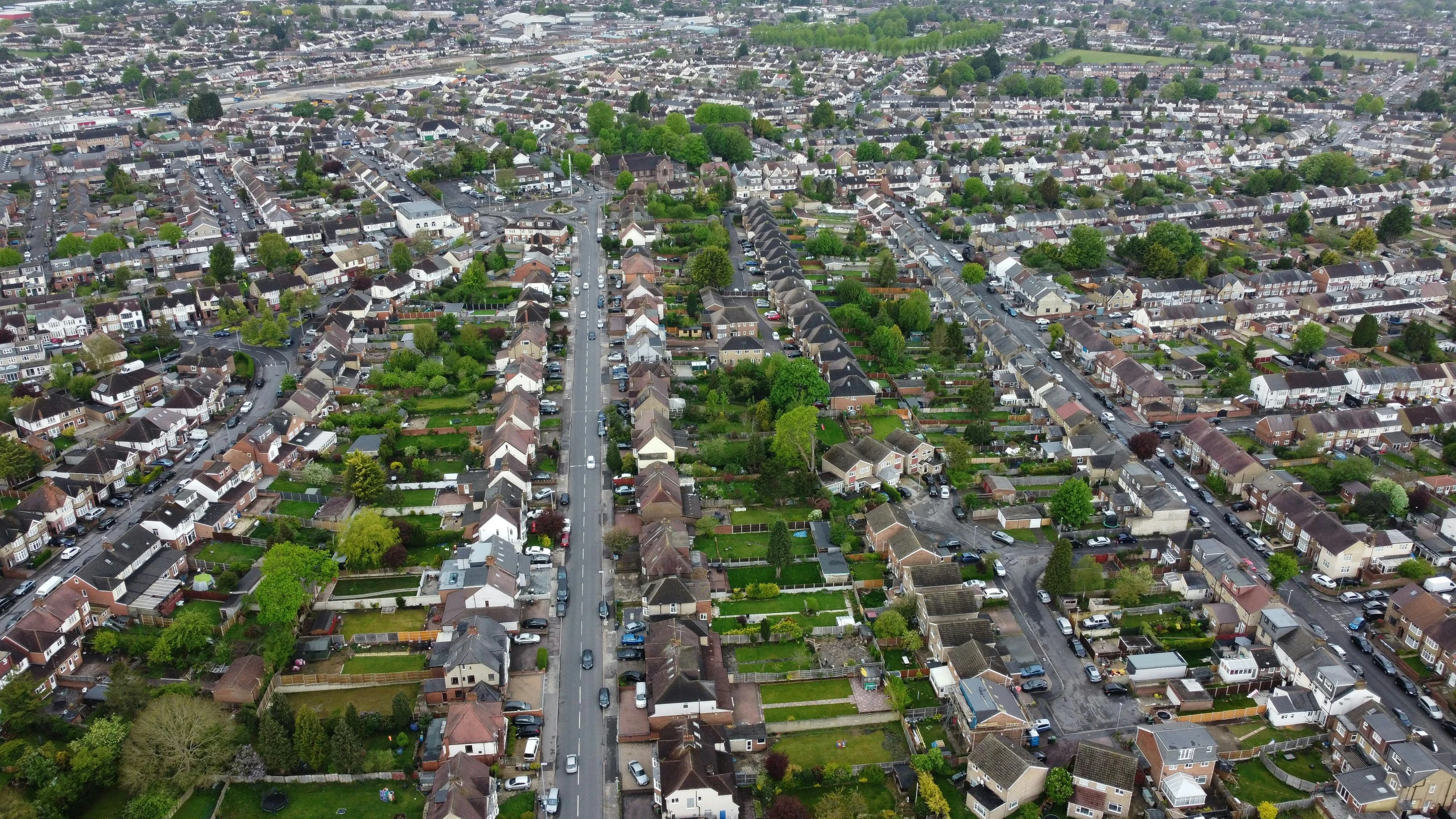 an aerial view of a city with lots of houses, by Kev Walker, superwide shot, thumbnail, suburbia street, 8 k wide shot