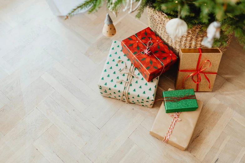 presents under a christmas tree on the floor, pexels, happening, background image, green and brown clothes, no watermarks, thumbnail