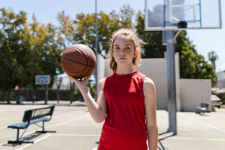 a woman holding a basketball on a basketball court, by Gavin Hamilton, dribble contest winner, portrait sophie mudd, 15081959 21121991 01012000 4k, sydney sweeney, girl wears a red dress