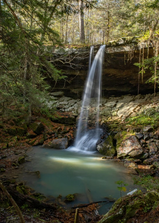 a waterfall in the middle of a forest, slide show, ohio, taken in the early 2020s, beautiful natural rim light